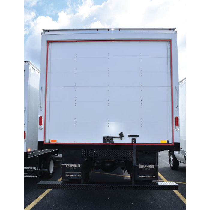 Rear view of a semi trailer with a commercial roll-up door, commonly serviced for spring, cable, and hardware repair in Kitsap County